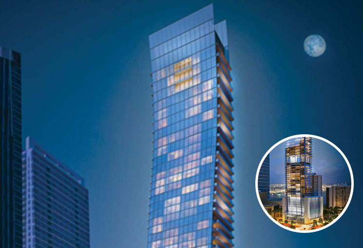 image of the echo brickell building bottom section being highlighted in a zoomed in portion of the image. image is at night with a dark blue night sky